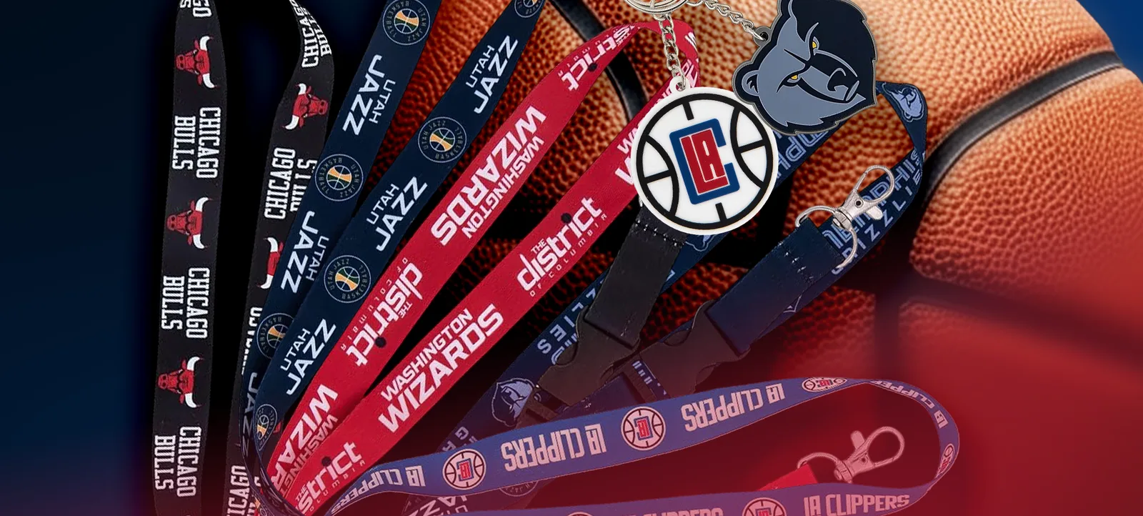 Basketball team lanyards and a keyring fanned out across a basketball