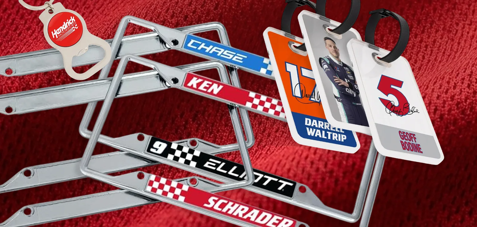 Chrome number plate frames and driver keyrings arranged on red mesh fabric